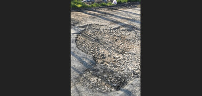 Дупки на пътя между село Слънчево и община Аксаково