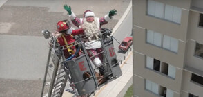 Дядо Коледа се качи на пожарен кран, за да изненада пациенти с COVID-19 (ВИДЕО)