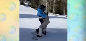 Шон Уайт носи Нина Добрев на ръце докато кара сноуборд