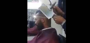 Мъж подстригва със сатър и чук (ВИДЕО)